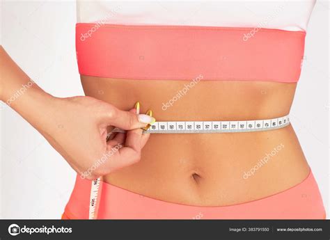 Girl The Brunette Costs Measures Her Hips With A Measuring Tape Stock Photo Kiy List Ru