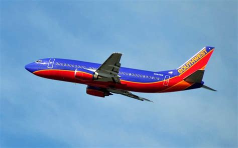 A Southwest Airlines Plane Flying In The Sky