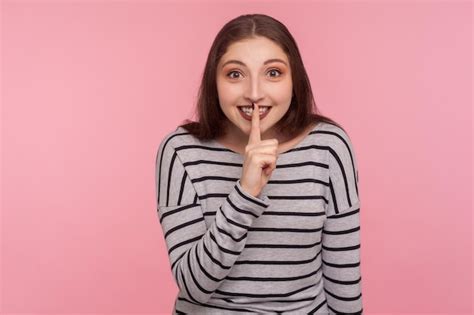 Premium Photo Shh Keep Silence Portrait Of Positive Smiling Woman