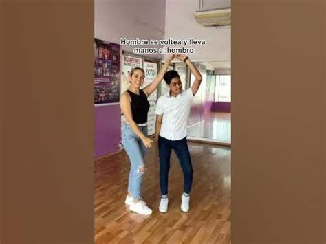 Two Women Are Dancing In An Empty Room