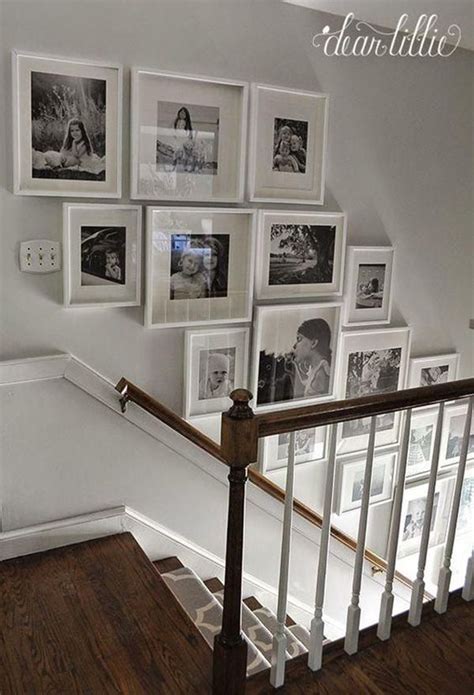 There Is A Staircase With Pictures On The Wall