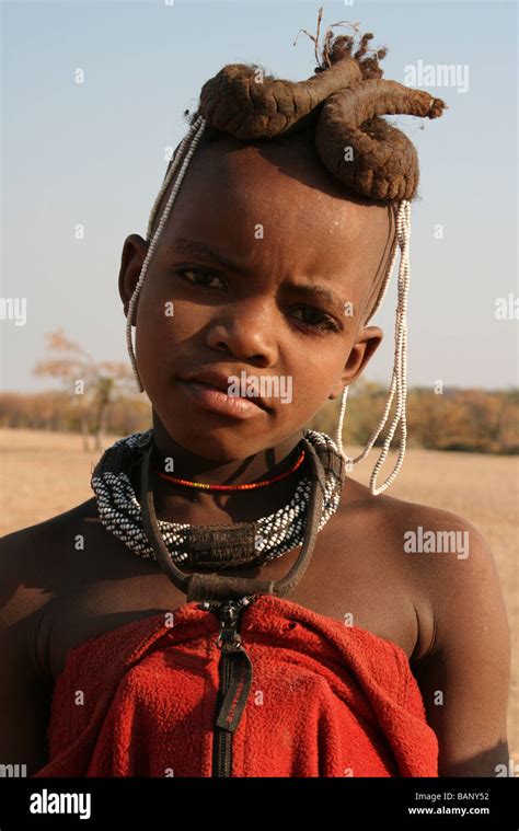 Portrait Of Himba Tribe Boy With Braided Hair Taken Nr Kunene River