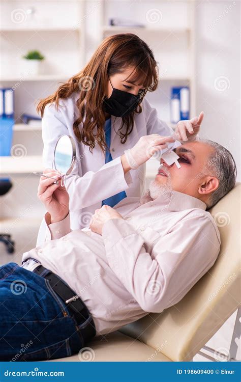 Old Man Visiting Young Female Doctor for Plastic Surgery Stock Photo ...