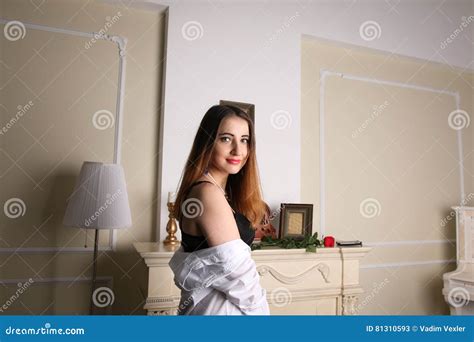 Woman In Black Lingerie And Man S Shirt Standing Next To The Fireplace Stock Image Image Of