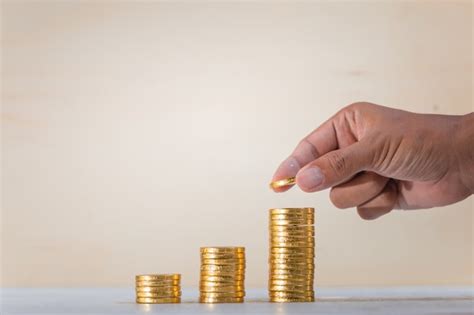 Premium Photo | Hand holding coins