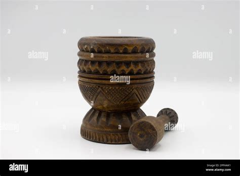 Wooden carved mortar and pestle Stock Photo - Alamy