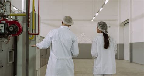 Manufacturing Bakery Industry Baker and Engineer Walking through the ...