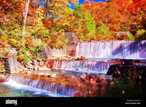 Beautiful View Of Waterfall Surrounding With Colorful Autumn Forest In Hot Spring Resorts Of