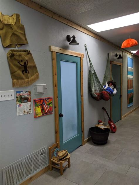 An Empty Hallway With Hammocks Hanging From The Ceiling And Other Items