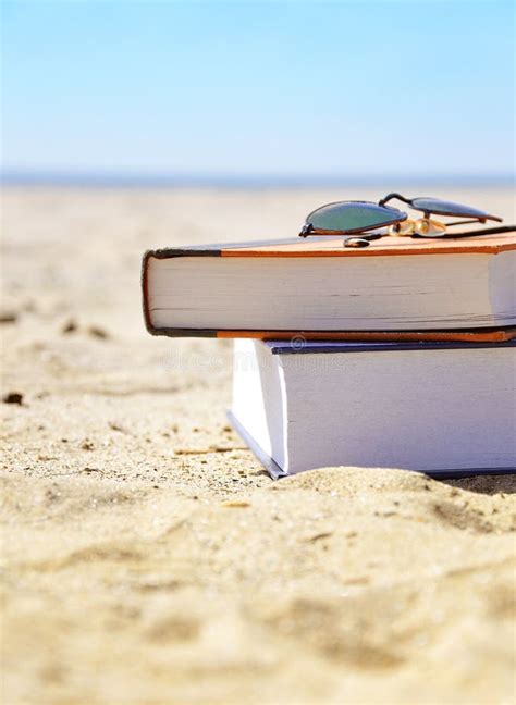 Vacation Beach With Books In Sand Stock Photo - Image of tourist, ocean ...