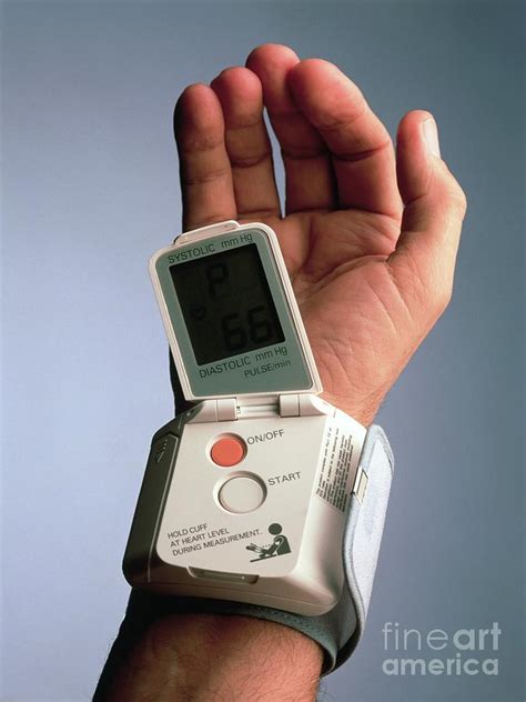 Portable Pulse Meter On A Man's Wrist Photograph by Oscar Burriel ...