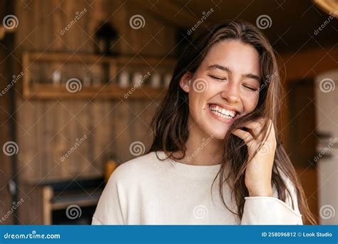 Close Up Positive Young Caucasian Woman With Closed Eyes Smiles Broadly