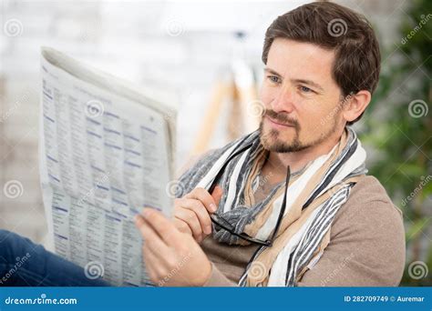 Portrait Mature Man Holding Glasses Reading Newspaper Stock Image