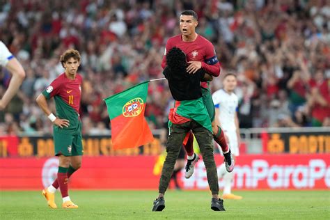 Cristiano Ronaldo Was Hugged By A Fan As Portugal Wins Euro Qualifier