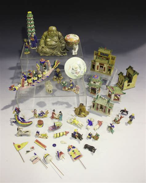 A Collection Of Chinese Pottery Miniature Figures And Ornaments Early