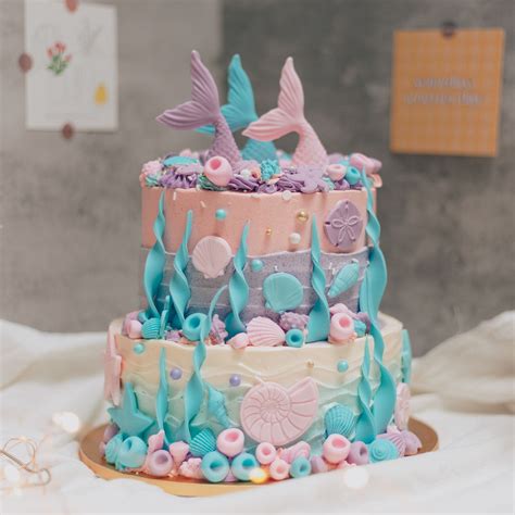 A Two Tier Underwater Mermaid Themed Cake Tiered Cakes Two Tier