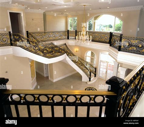 Grand staircase resitential estate home Stock Photo - Alamy