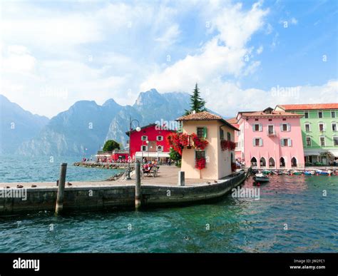 Torbole Italy Lake Garda Boardwalk With Houses Tourists And Boats