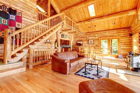 Luxury log cabin living room with leather sofa. — Stock Photo ...