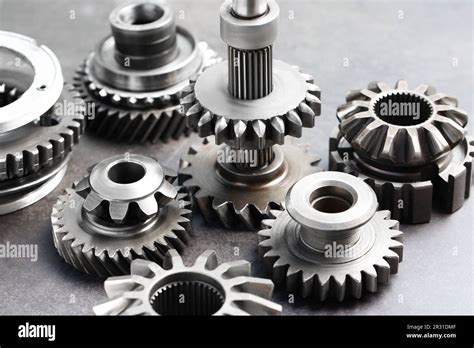 Different Stainless Steel Gears On Light Grey Background Closeup Stock