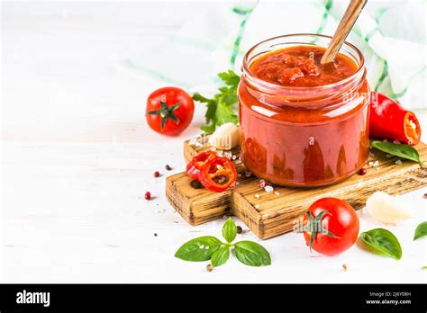 Tomato sauce with herbs and spices at white background Stock Photo - Alamy