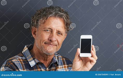 My Hand Held Personal Assistant A Portrait Of A Happy Mature Man