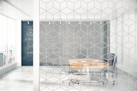 an office with a table and chairs in the center, through glass ...