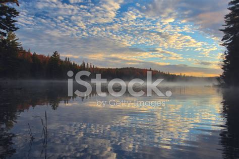 Colorful Sunrise Sky And Clouds Over Gorgeous Lake Stock Photo ...