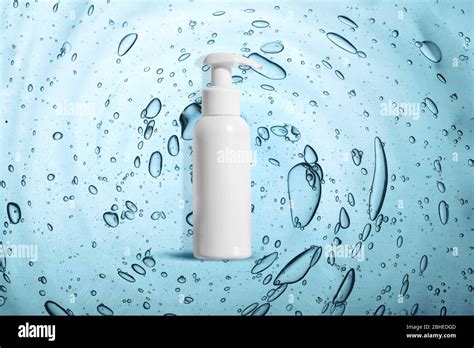 Hand Sanitizer Bottle On Background With Texture Of Hand Disinfecting