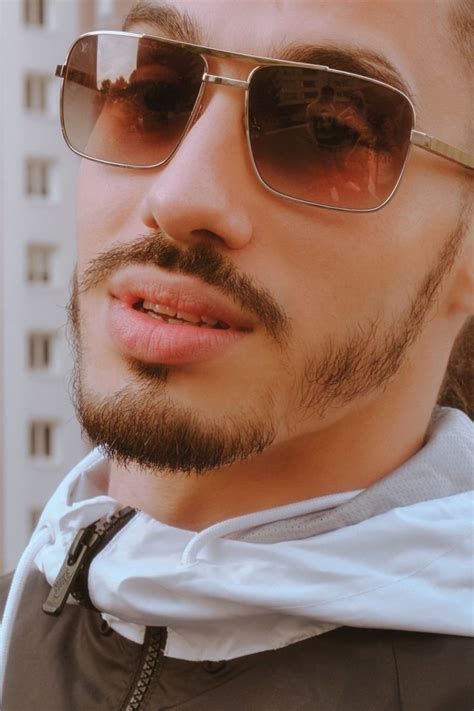 A Close Up Of A Person Wearing Sunglasses