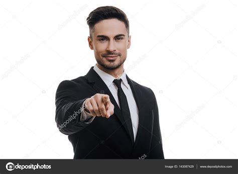 Businessman In Black Suit Pointing Finger Stock Photo By Gstockstudio