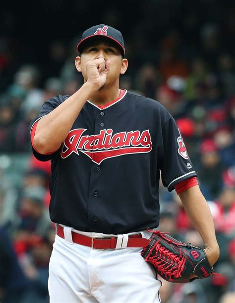 Cleveland Indians Carlos Carrasco tries to keep his hand warm in the ...