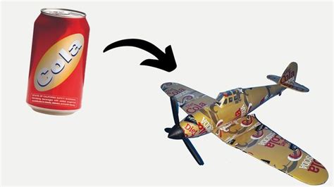 An Airplane Flying Next To A Can Of Soda And A Model Plane With The