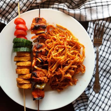 Jollof Spaghetti Chicken Skewers And Fried Plantain