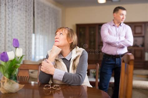 Upset Elderly Woman After Quarrel With Adult Son Stock Photo Image Of