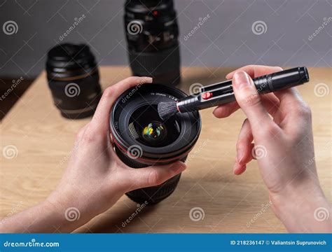 Hands Closeup Cleaning Digital Camera Lens With Professional Brush Tool