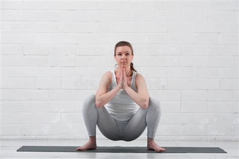 Young Flexible Woman Practicing Yoga On Grey Mat Stock Image Image Of