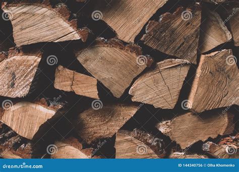 A Stack Of Dry Firewood Wooden Logs Laid In A Heap Stored For Winter