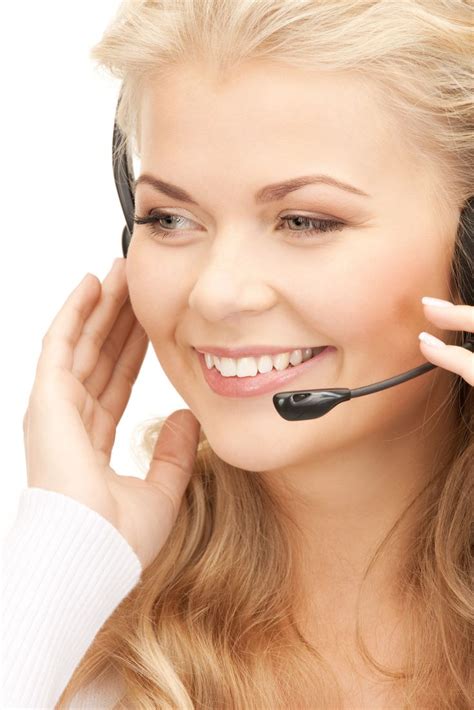 A Beautiful Blond Woman Wearing A Headset And Smiling