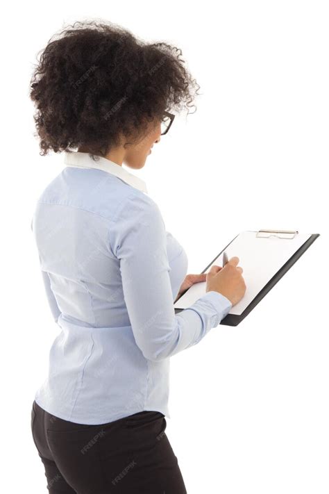 Premium Photo Back View Of African American Woman Writing Something On Clipboard Isolated On