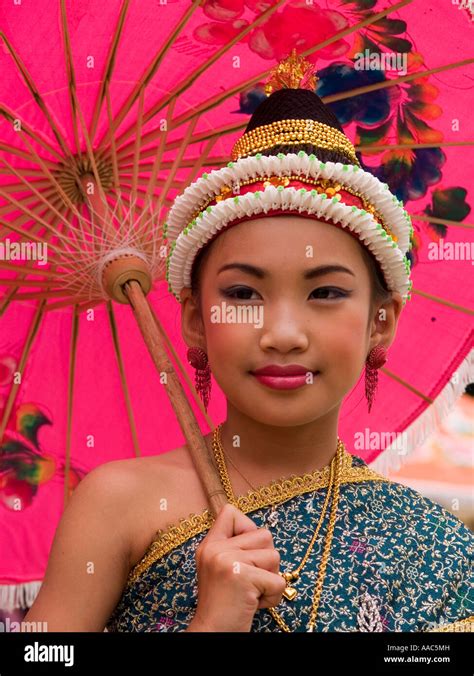 Lao Girl Traditionally Dressed At Songkran New Years Parade Under Red Umbrella Luang Prabang