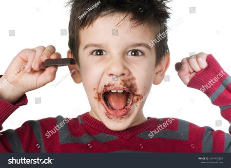 Smiling Kid Eating Chocolate Smeared Stained Stock Photo 1547475554