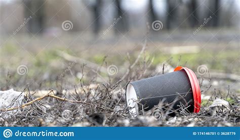 Enviromental Pollution Paper Cup For Coffee And Red Plastic Cover On A