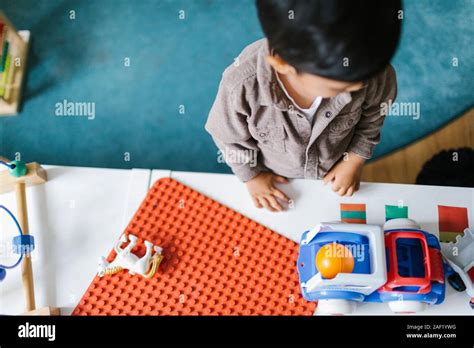 Boy Looking At Toys Stock Photo Alamy