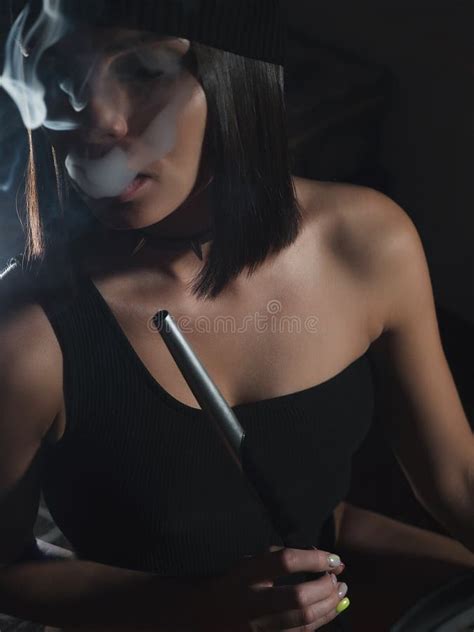 Brunette Smoking Hookah In Dark Room Stock Photo Image Of Fume Dark 196487482