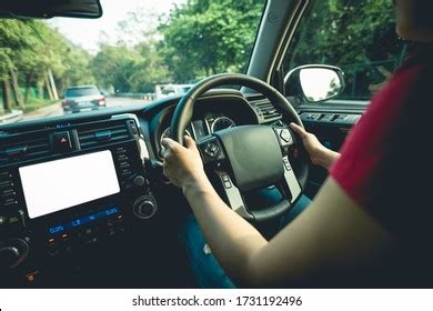 People Hands Holding Steering Wheel While Stock Photo