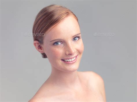 Redheaded Beauty Head And Shoulders Shot Of A Beautiful Nude Woman Isolated On Grey Stock