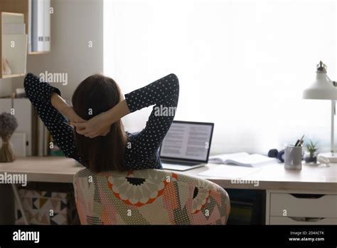 Distracted From Distant Study Young Woman Relaxing At Home Stock Photo