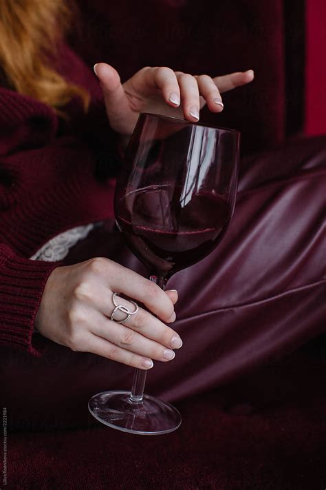 Crop Female S Hands Holding Red Wine Glass By Stocksy Contributor