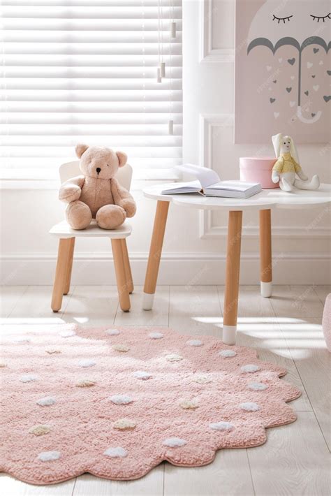 Premium Photo | Round pink rug on floor in children's room